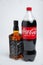 Riga, Latvia February 12.2022:Photo of Coca-Cola plastic bottle and Jack Daniel whiskey Isolated on white Background With clipping