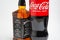 Riga, Latvia February 12.2022:Photo of Coca-Cola plastic bottle and Jack Daniel whiskey Isolated on white Background With clipping