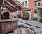 Riga, Latvia - July, 2017: medieval cafe pub barrels and vintage chests with medieval flags and standards