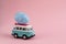 Riga, Latvia - March 04 2019: Hippie Bus with Easter Colorful Eggs on the Roof Miniature Small Car Banner