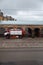 RIGA, LATVIA - MARCH 16, 2019: Driver washes firefighter truck at a depo from behind - Fire truck is being cleaned