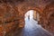 RIGA, LATVIA - MAY 06, 2017: View on the old brick arch and man on the bicycle that are located in the city cent