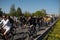 RIGA, LATVIA - MAY 1, 2019: Bicycle parade on Labor day with families and friends on public space road with other cars