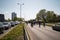 RIGA, LATVIA - MAY 1, 2019: Bicycle parade on Labor day with families and friends on public space road with other cars