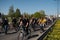 RIGA, LATVIA - MAY 1, 2019: Bicycle parade on Labor day with families and friends on public space road with other cars