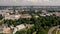 Riga, Latvia - May, 2019: Aerial top view of the city landscapes with roofs of houses, park and ancient Riga\'s churches.