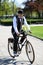 RIGA, LATVIA - MAY 7, 2016: Tweed ride. Unknown man driven by an old bicycle