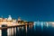 Riga, Latvia. Night Abstract Boke Bokeh Background Effect. Design Backdrop. Famous Castle And Dome Cathedral In Evening