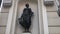 Riga, Latvia, A person standing in front of a building