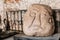 Riga, Latvia. Salaspils Stone Head Is Stone Statue Of Ancient Slavic Idol In Museum