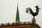 Riga, Latvia: Sculpture of a rooster on a spire in the center of the old city. Church of St. Peter