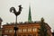 Riga, Latvia: Sculpture of a rooster on a spire in the center of the old city. Church of St. Peter