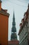 Riga, Latvia: Spire Church of St. Peter is one of the symbols and one of the main sights of the city of Riga. Golden pawn on top