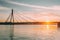 Riga, Latvia. Vansu Cable-Stayed Bridge Over The Daugava River, Western Dvina In Bright Sunset Or Sunrise Time