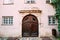 Riga Latvia. Wooden Door Of Portal Decorated By Molding On Facade