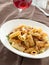 Rigatoni pasta with tomato meat sauce and wine