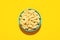 Rigatoni pasta top view on a yellow background