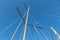 Rigging mast and halyards of a sailing boat under a beautiful blue sky