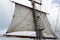 Rigging, mast and mainsail of a vintage sailing ship