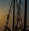 Rigging on an vintage wooden sailboat in the morning fog.