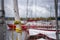 On rigging wound a sail of a staysail, on a moored yacht on the shore