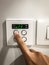 A right hand switches on the air conditioning system