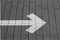 Right pointing arrow on asphalt in black and white