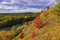 The right slope of the Sylva river valley with rocky gypsum outcrops in autumn decoration