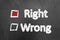 Right wrong chalk text and check box on blackboard or chalkboard