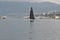 Rijeka, Croatia September 2020. Sailing boat with black open sails in the port of Rijeka.