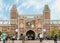 Rijksmuseum building facade with tourists and cyclists in Amsterdam