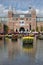 Rijksmuseum National Museum with I Amsterdam sign and tulips in the reflecting pool. Amsterdam