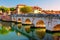 Rimini cityscape. Famous Bridge of Tiberius in Rimini, Italy. Ancient landmark Ponte di Tiberio