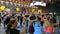 Rimini, Italy - june 2019: Fitness Workout in Gym - People doing Zumba Exercises during Public Event with Music and Teacher on Sta