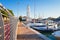 Rimini, Italy. Lighthouse in sea port of Rimini. Boats moored in harbor