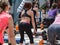 Rimini, Italy - may 2019: Girls doing Weightlifting Exercises at Outdoor Gym with Step Platform: Fitness Workout