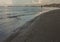 Rimini, Italy - walks on a beach in the evening.