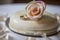 ring cake with a single delicate rose on top