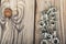 Ring nuts with bolts, zinc plated on wooden background