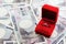 Ring in red box with yen banknotes in background