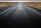 Ring Road, Iceland - Low view of long straight road across moss-covered lava