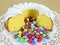 Ring-shaped sponge cake and colour-varied sugar-coated chocolate confectionery