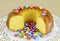 Ring-shaped sponge cake and sugar-coated chocolate confectionery