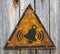 Ringing Bell Icon on Rusty Warning Sign.