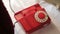 Ringing a red Rotary dial telephone