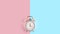Ringing twin bell vintage classic alarm clock Isolated on blue and pink pastel colorful trendy background