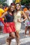 RIO DE JANEIRO, BRAZIL - Mar 03, 2014: Carnival street party in Rio with two women in festive colourful outfits