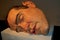 Rio de Janeiro, Brazil - March 30, 2014: Mask II, a sculpture by the Australian hyperrealist sculptor, Ron Mueck, at the Museum of