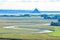 Rio makes its way between fields and farmland up to Mont Saint Michel