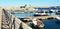 Rio Marina port, bridge, rock, waves and boats in Tuscany, in Elba island, Italy